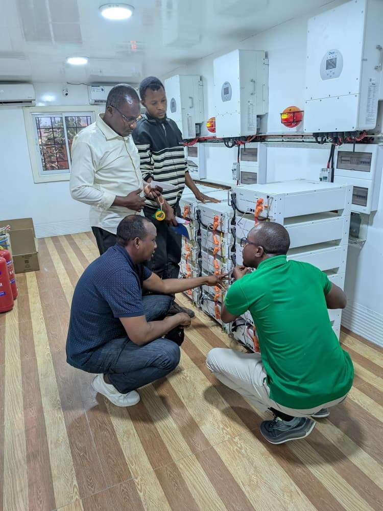 A A Nafada Solutions engineering team installing and configuring commercial battery energy storage and solar inverters